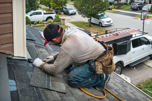 Professional Emergency Roof Repair technician working in Wellesley, MA